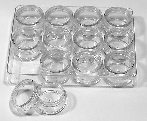 12 empty screw-top jars in a box 12 empty screw-top jars in a box